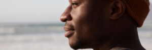 man at beach, thinking about calling an oral surgeon santa rosa ca