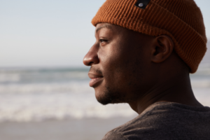 man at beach, thinking about calling an oral surgeon santa rosa ca
